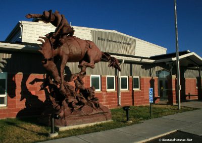 Picture of the Bronc Rider sculpture by Robert Scriver (1914–1999) in Babb, Montana.