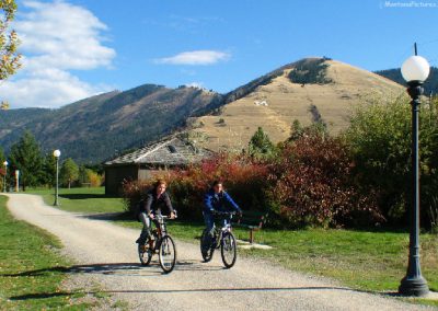 Bicycle riders near Mount Sentinel on Missoula, Montana.