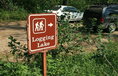 Picture of the Logging lake trailhead sign in Glacier National Park.