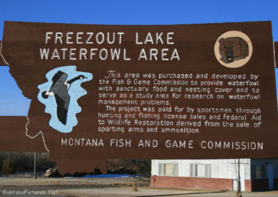 March picture of the Freezeout Lake Waterfowl Management Area sign on Highway 89. Image is from the Freezeout Lake Picture Tour.