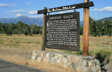 July picture of the Emigrant Gulch Historical Sign on Highway 89. Image is from the Emigrant, Montana Town Picture Tour.