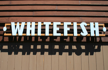 June picture of the Train Depot sign in Whitefish, Montana. Image is from the Whitefish, Montana Picture Tour.