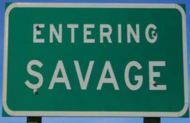 June picture of the Savage, Montana sign on Highway 16. Image is from the Savage, Montana Picture Tour.