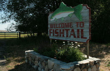 July picture of the Fishtail, Montana Welcome sign on Highway 78. Image is from the Fishtail, Montana Picture Tour.