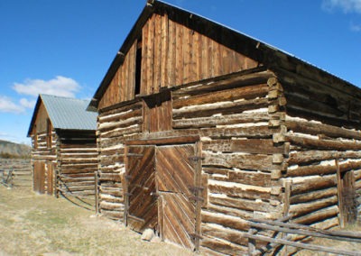 March picture of a log cabin barns in Dewey, Montana. Image is from the Dewey, Montana Picture Tour.