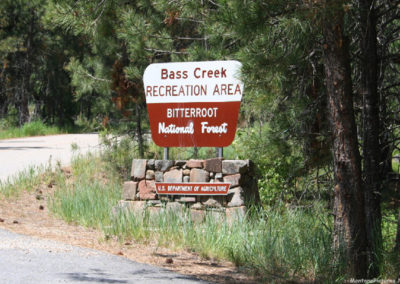 June picture of the Bass Creek Trailhead sign in the Bitterroot Mountains near Stevensville, Montana. Image is from the Stevensville, Montana Picture Tour.