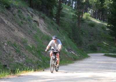 A mountain bike rider in the entrance of Blodgett Canyon west of Hamilton, MT