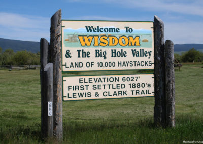 June picture of the Wisdom Montana Welcome sign on Highway 43. Image is from the Wisdom, Montana Picture Tour.