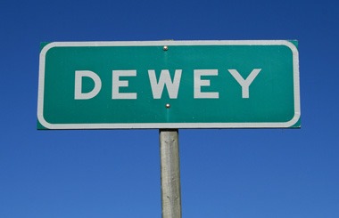 June picture of the Dewey Sign on Highway 43 in SW Montana. Image is from the Dewey, Montana Picture Tour.