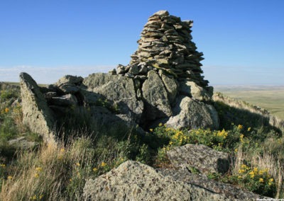 June picture of the second ancient rock cairn you pass as you hike to the summit of Gold Butte in the Sweet Grass Hills Image is from the Sweet Grass Hills Montana Picture Tour.