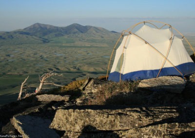 June sunset picture of the tent on the summit of Gold Butte (6512 feet) in the Sweet Grass Hills. Image is from the Sweet Grass Hills Montana Picture Tour.