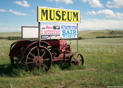 July picture of the Harlowton, Montana Museum sign on Highway 12 . Image is from the Harlowton Montana Picture Tour.