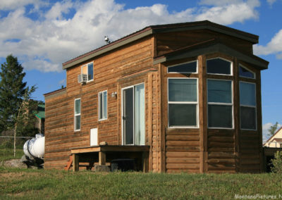 June picture of a Mobile Home with wood siding in Martinsdale, Montana. Image is from the Martinsdale and Lennep Town Montana Picture Tour.