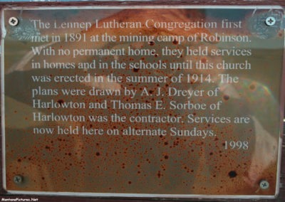 July picture of the sign with Trinity Lutheran Church history in Lennep, Montana. Image is from the Martinsdale and Lennep Town Montana Picture Tour.