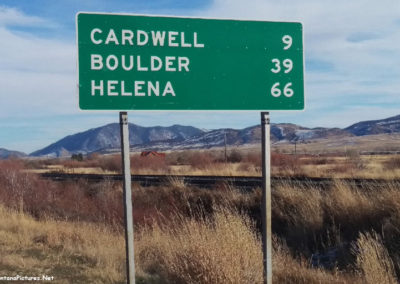 November picture of the mileage sign on Highway 68 in Whitehall, Montana. Image is from the Whitehall Montana Picture Tour.