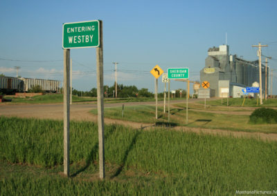 A June Picture of the Entering Westby Sign on Montana Highway 5. Image is from the Westby Montana Picture Tour.