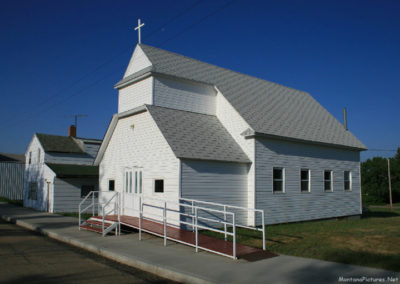 A June picture of the Assembly of God Church in Westby, Montana. Image is from the Westby Montana Picture Tour.