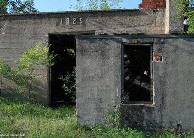 A June picture of the old City Garage built in 1925 in Westby, Montana. Image is from the Westby Montana Picture Tour.
