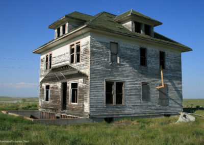 A June picture of an old Farm house near Westby, Montana. Image is from the Westby Montana Picture Tour.