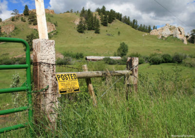 June 2018 picture of a No Trespassing sign along the Sign Spring Creek Road FS274 near Checkerboard, Montana. Image is from the Checkerboard Montana Picture Tour.