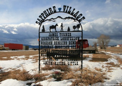 January 2019 picture of a the Sapphire Village sign on Spring Creek Road FS274. Image is from the Checkerboard Montana Picture Tour.