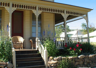 July picture of an ornate wooden front on a home in Virginia City, Montana. Image is from the Virginia City, Montana Picture Tour.