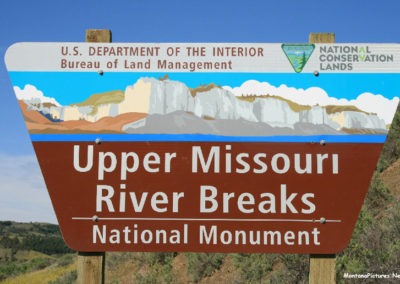 June picture of the Upper Missouri River Breaks Sign on Highway 191 in the Charles M Russell National Wildlife Refuge. Image is from the James Kipp Recreation Area Picture Tour.