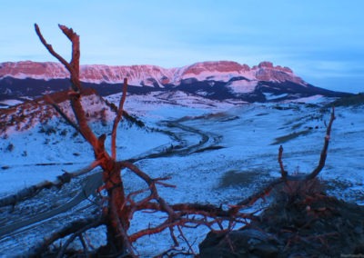 April picture of a snow covered Ear Mountain in the Rocky Mountain Front. Image is from the Augusta Montana Picture Tour.