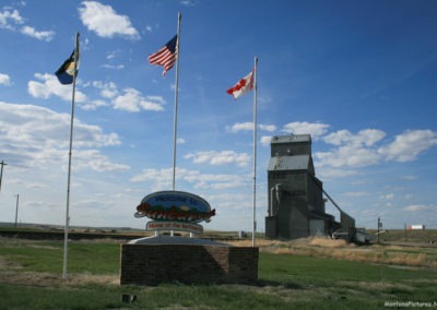 May picture of the Sunburst Montana Welcome Sign along Interstate 15. Image is from the Sunburst Montana Picture Tour.