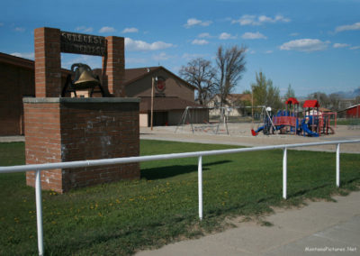 May picture of the Old School Bell in front of the Sunburst Elementary School. Image is from the Sunburst Montana Picture Tour.