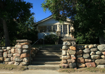 July picture of residential rock wall in Shelby. Image is from the Shelby Montana Picture Tour.
