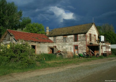 June picture of an car repair shop. Image is from the Toston Montana Picture Tour.