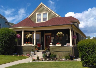 July picture of a green residential home in Anaconda Montana. Image is from the Anaconda Montana Picture Tour.