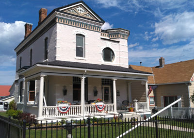 July picture of a residential home with Fourth of July decorations in Anaconda Montana. Image is from the Anaconda Montana Picture Tour.