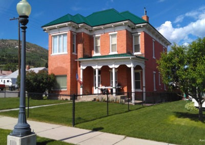 July picture of a residential home with old fashion street light in Anaconda Montana. Image is from the Anaconda Montana Picture Tour.