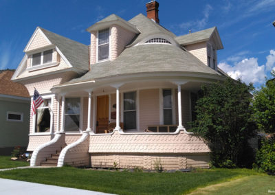 July picture of a residential home with a pink turret in Anaconda Montana. Image is from the Anaconda Montana Picture Tour.