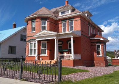 July picture of a residential home with a rock garden in Anaconda Montana. Image is from the Anaconda Montana Picture Tour.