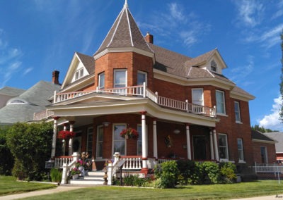 June picture of a residential home with a turret in Anaconda Montana. Image is from the Anaconda Montana Picture Tour.