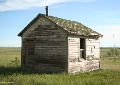 June picture of an old shed near Powderville, Montana. Image is from the Powder River Picture Tour.