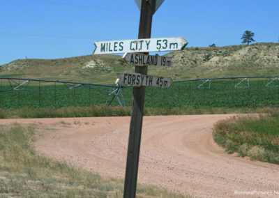 July picture of the mileage sign on Highway 59 near Ashland, Montana. Image is from the Powder River and Tongue River, Montana Picture Tour.