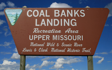 June picture of the Coal Banks Landing sign near Virgelle, Montana. Image is from the Coal Banks Landing Montana Picture Tour.