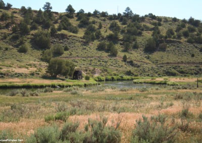 July picture of a Metal Water Wheel on the banks of the Tongue River. Image is from the Powder River and Tongue River, Montana Picture Tour.