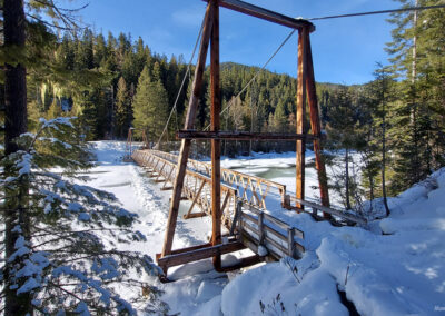 February picture of the view north from the foot bridge spanning the Lochsa River in the Clearwater National Forest. Image is from the Jerry Johnson Hot Springs Picture Tour.