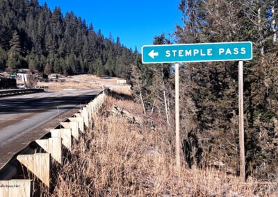 December view of the Stemple Pass Turn Off sign on State route 279. The pass is located 20 miles south of Lincoln Montana.