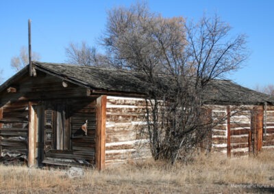 January picture of an antique log cabin home in Radersburg, Montana