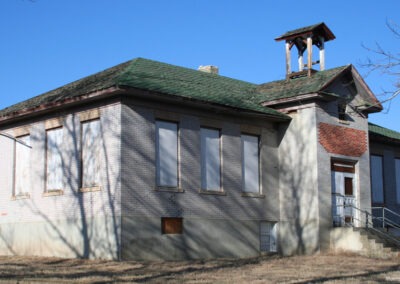 Close-up January picture of an old brick schoolhouse in Radersburg, Montana